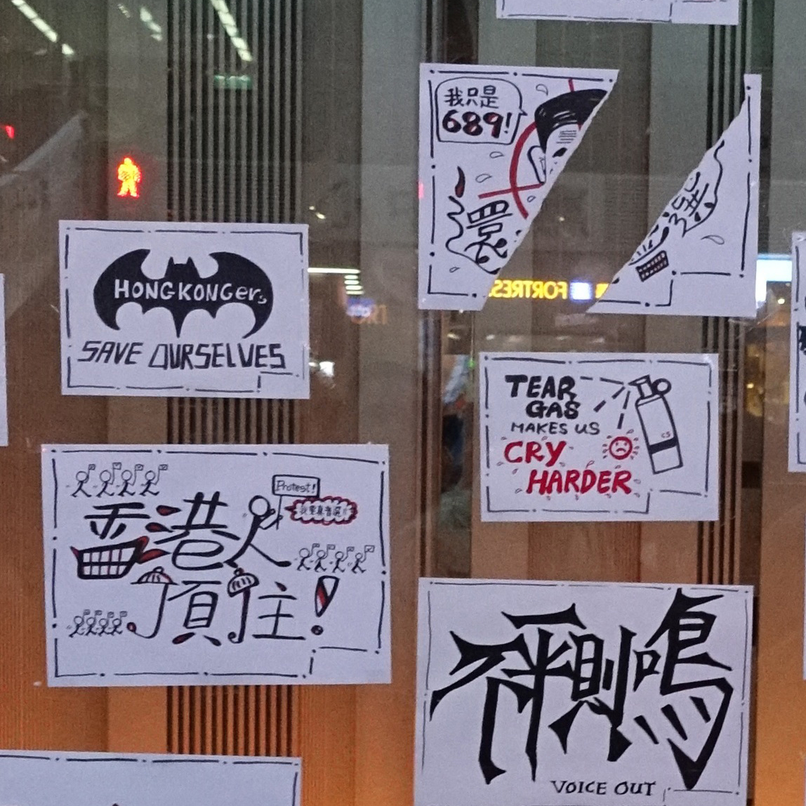 Protest posters that say 'Tear gas makes us cry harder'