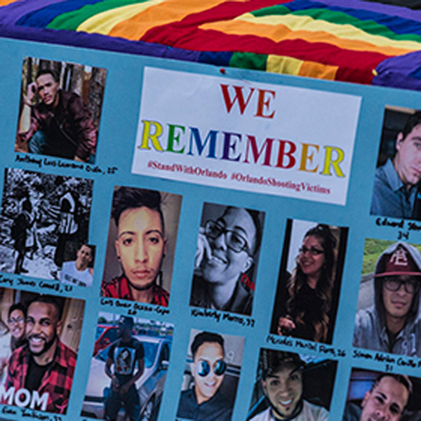 Poster saying 'We remember' with the names and pictures of the victims of the nightclub shooting