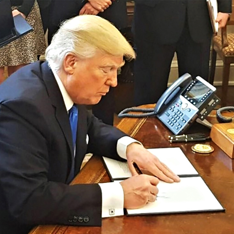 President Trump signing an Executive Order