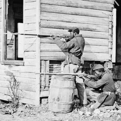 Two Black civil war soldiers aiming rifles