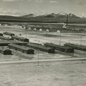 Rows of long cabins in a Japanese incarceration camp