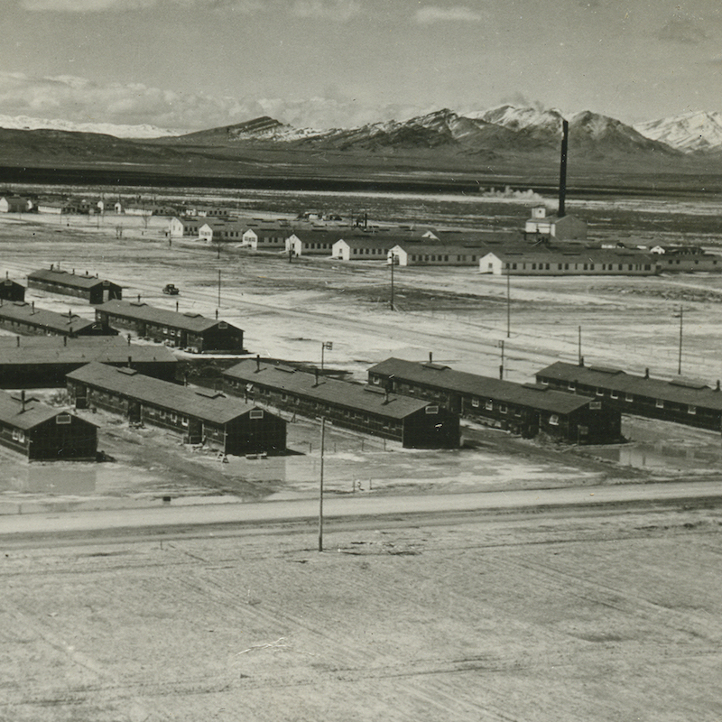 Rows of long cabins in a Japanese incarceration camp