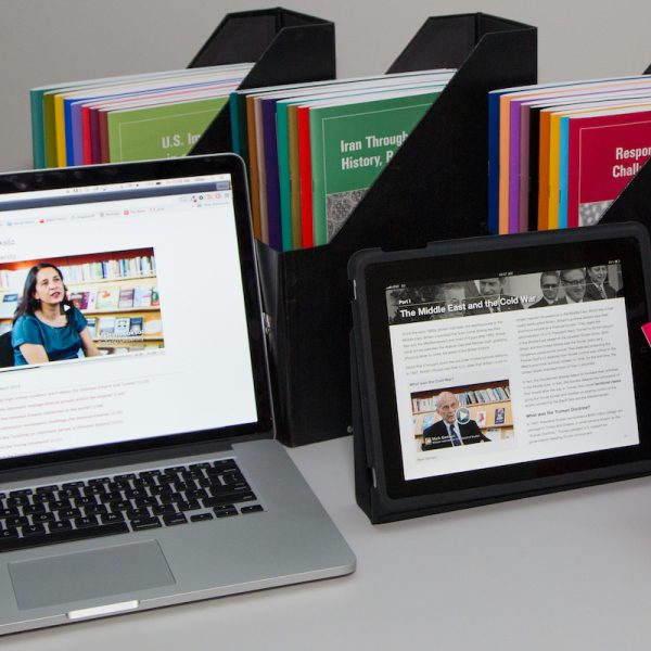 Copies of Choices Program print curriculum units with a laptop and an iPad showing images from the Digital Editions format