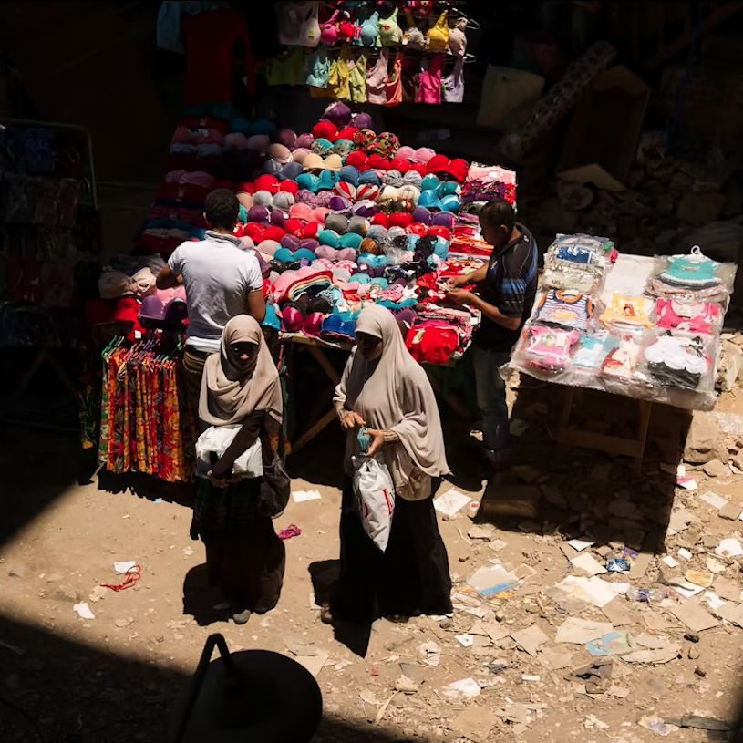 Two women wearing hijabs shopping in a market in Cairo, Egypt, in 2012.
